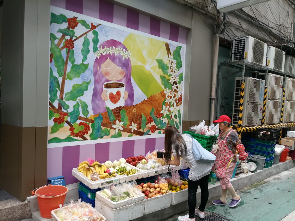 Fruit vendor next to a convenience store, The Healthiest City in Asia